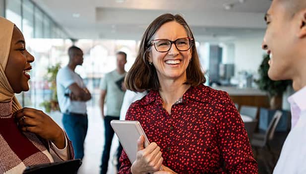 woman smiling at colleagues