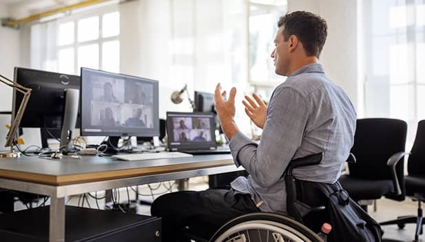 man in office talking on a video call
