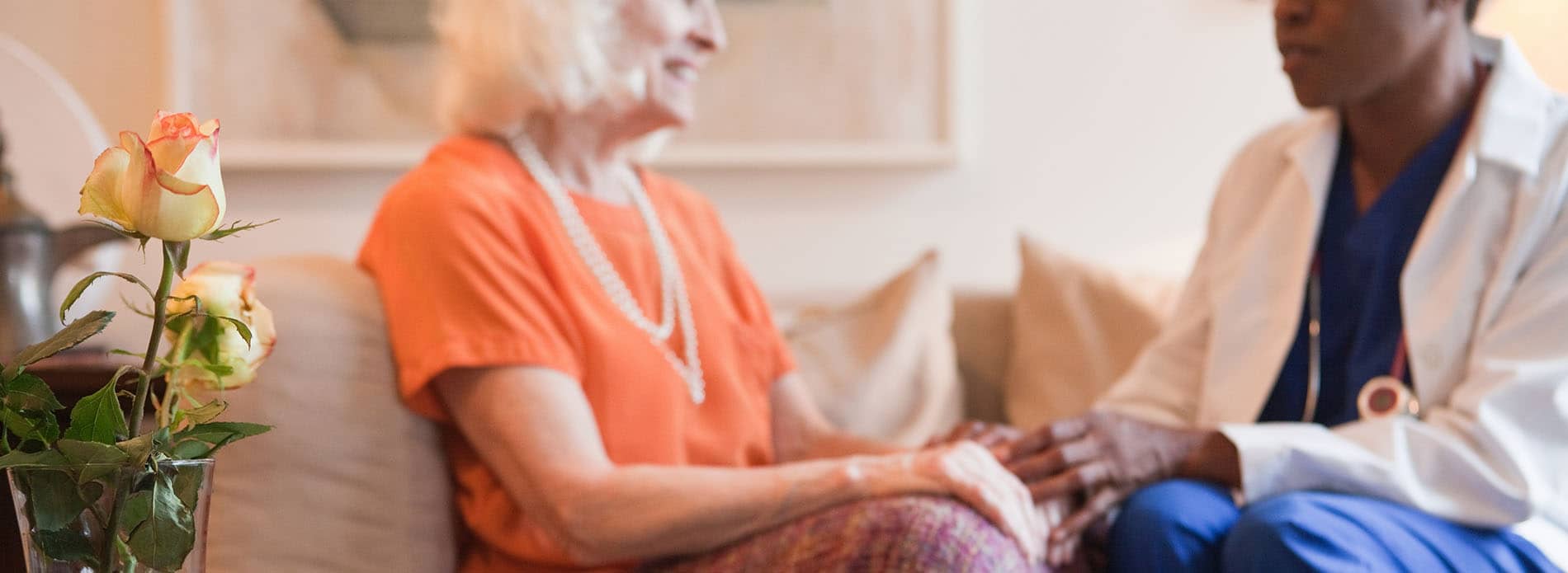 Doctor speaking to elderly patient
