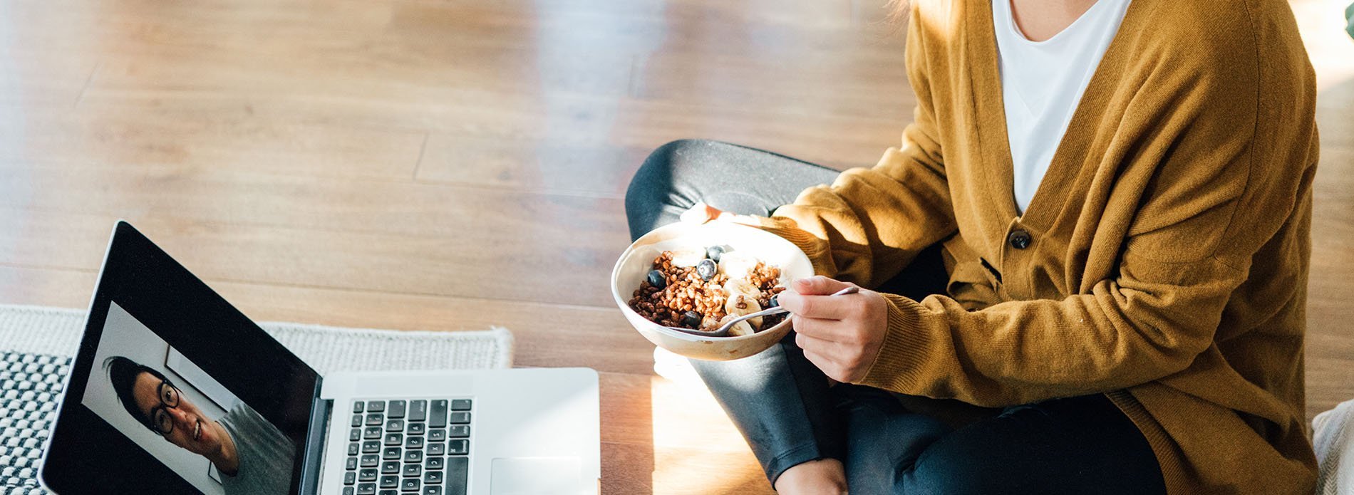 Woman eating cereal while in a Teams meeting