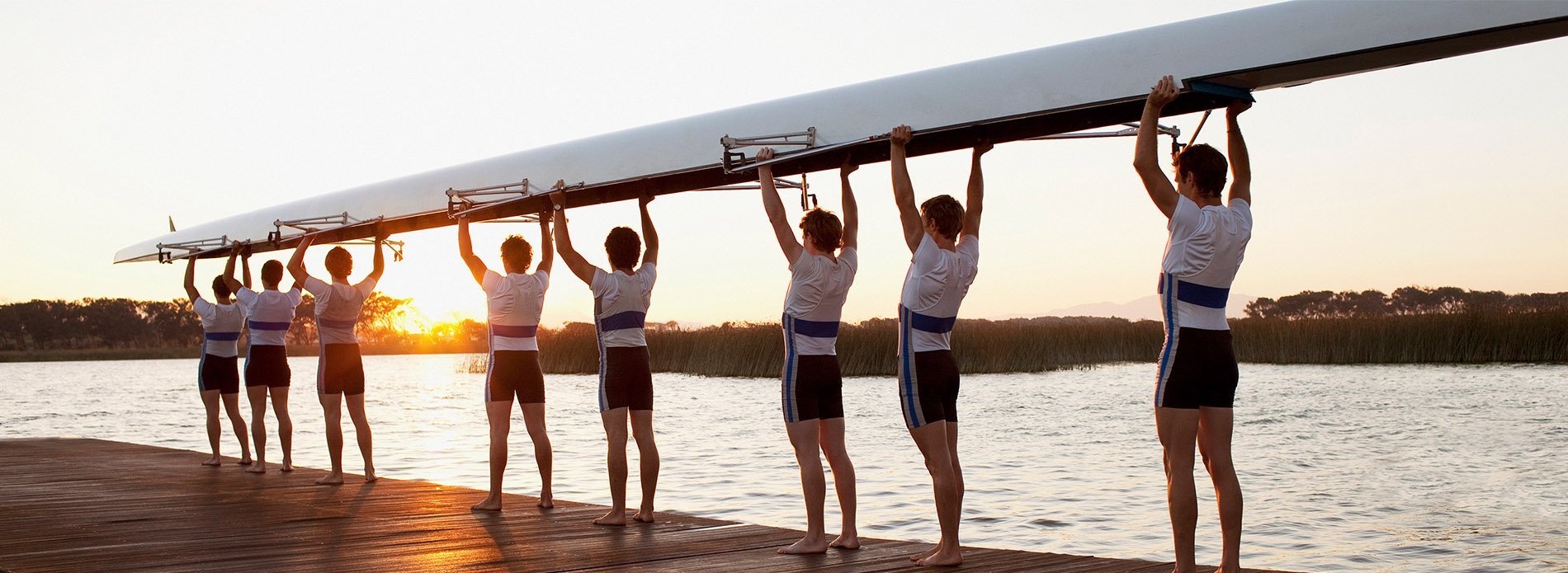 Rowing team with boat