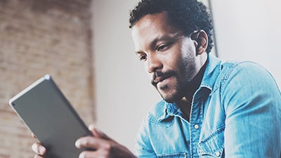 Man looking at iPad