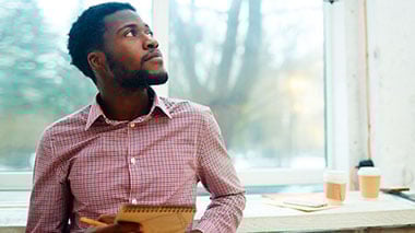 man staring into space