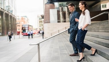 Man and woman walking down stairs
