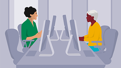 Two women on computers