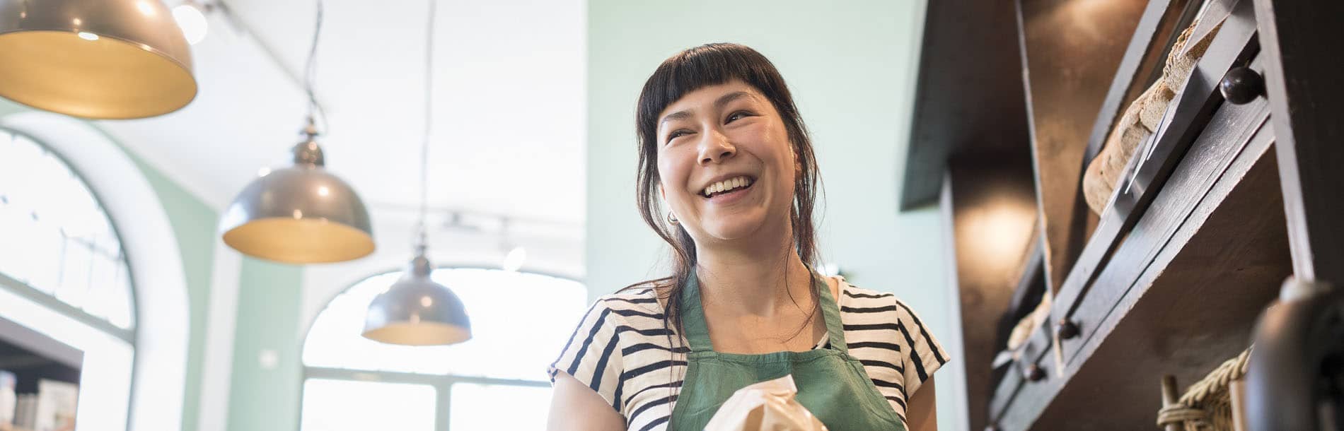 small business owner of bakery smiling