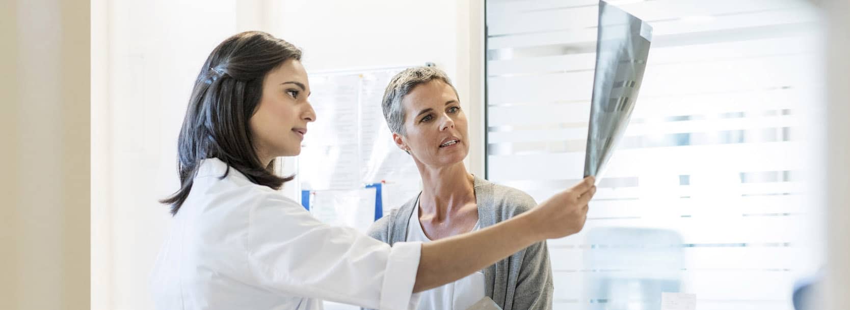 Specialist looking at scan results with patient