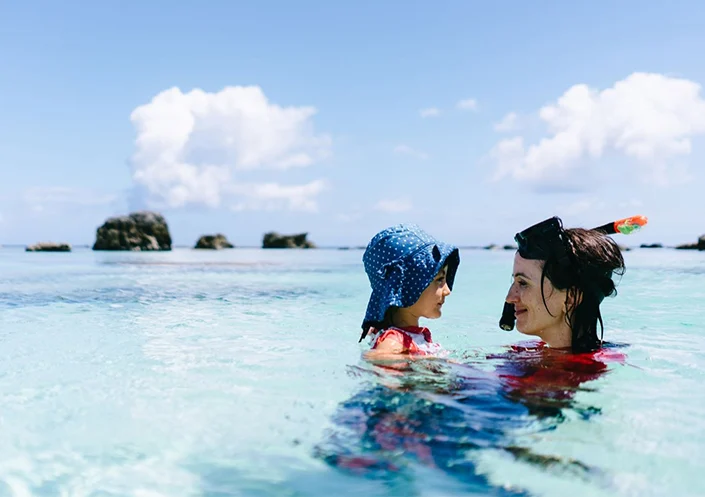 Mother and daughter swimming