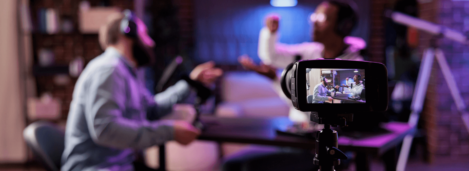 camera filming men doing a podcast